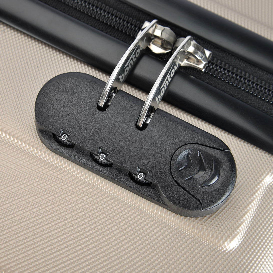 BONTOUR “spinner” közepes duplakerekes gurulós bőrönd, pezsgő-VASBÚTOR