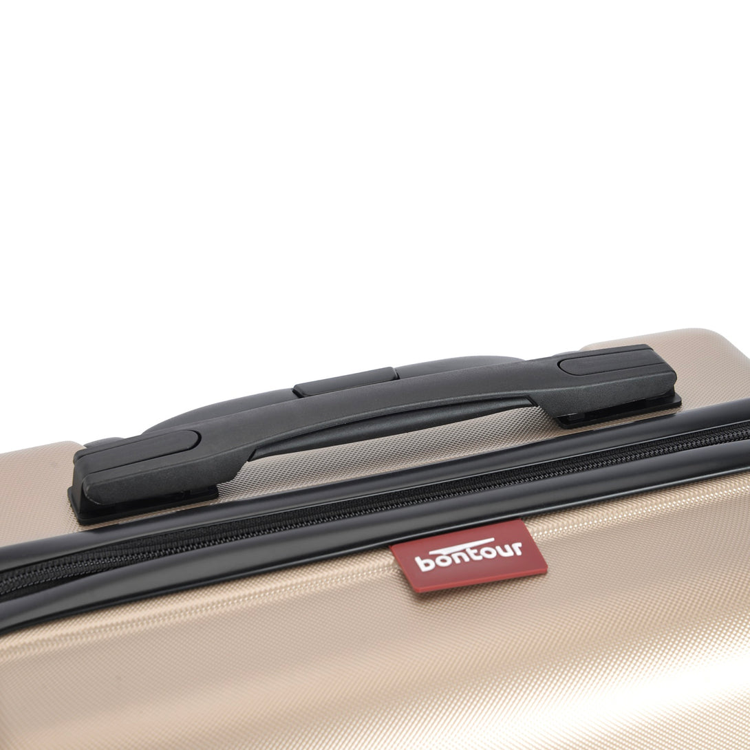 BONTOUR “spinner” közepes duplakerekes gurulós bőrönd, pezsgő-VASBÚTOR