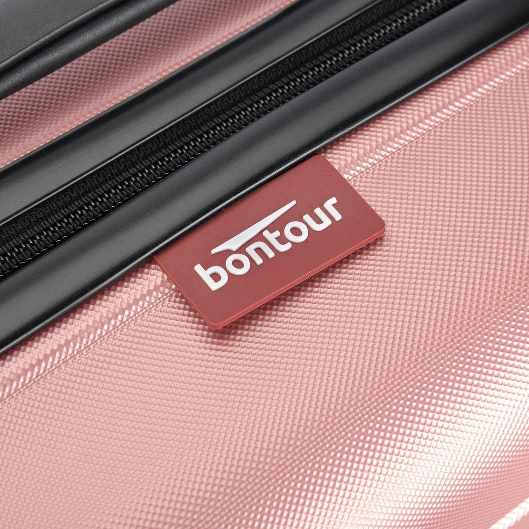 BONTOUR “spinner” közepes duplakerekes gurulós bőrönd, rolsegold-VASBÚTOR